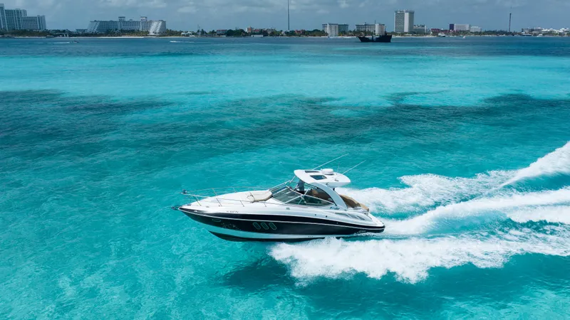  Yacht Photos Pics 2015 Cruisers Yachts 350 Express cruising on turquoise waters.