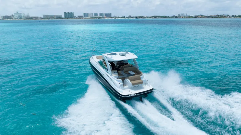  Yacht Photos Pics 2015 Cruisers Yachts 350 Express cruising on vibrant blue ocean waters.