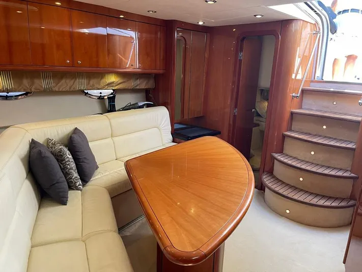  Yacht Photos Pics Luxurious interior of 2005 Sunseeker Portofino 53 yacht with elegant wood finishes.