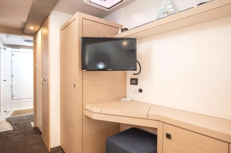 Love Is Yacht Photos Pics Interior of 2019 Fountaine Pajot Lucia 40 Maestro with TV and desk area.