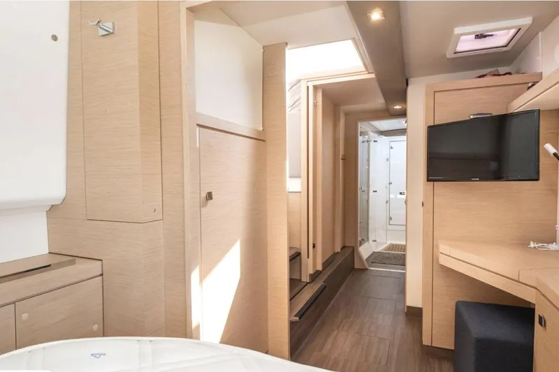Love Is Yacht Photos Pics Interior of 2019 Fountaine Pajot LUCIA 40 MAESTRO catamaran, featuring modern wood finish and TV.