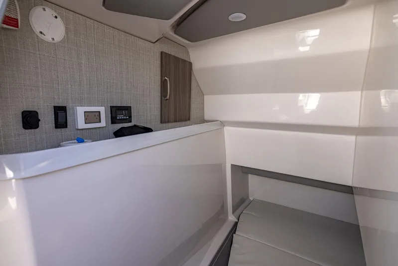 Absolutely Knot Yacht Photos Pics 2022 Regal LX36 interior cabin with modern controls and sleek design.