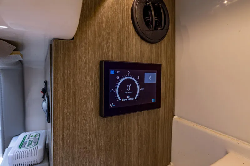 Absolutely Knot Yacht Photos Pics Control panel in 2022 Regal LX36 boat interior, displaying roll angle and voltage.
