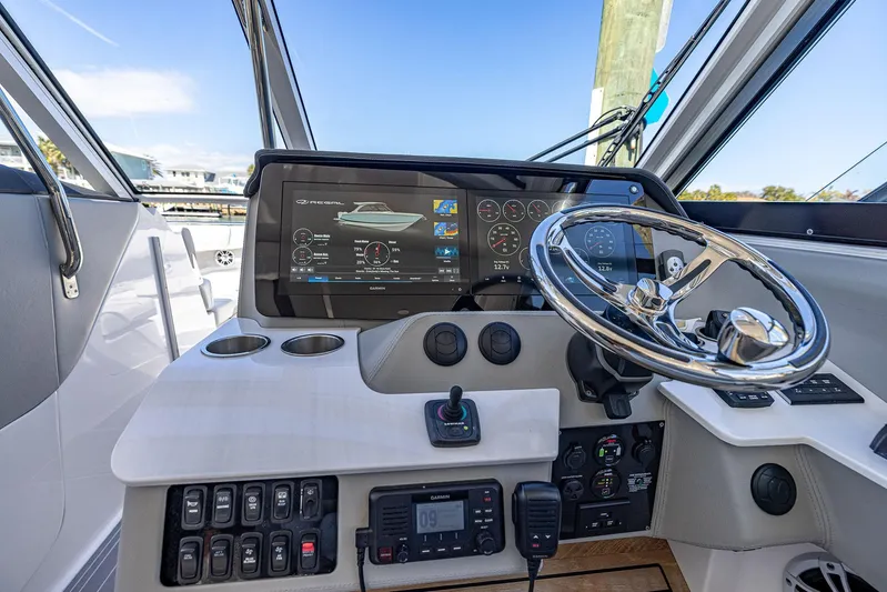 Absolutely Knot Yacht Photos Pics 2022 Regal LX36 boat helm with advanced navigation display and controls.