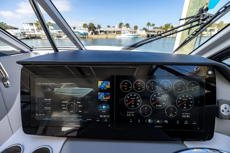 Absolutely Knot Yacht Photos Pics 2022 Regal LX36 dashboard with digital displays and navigation controls.