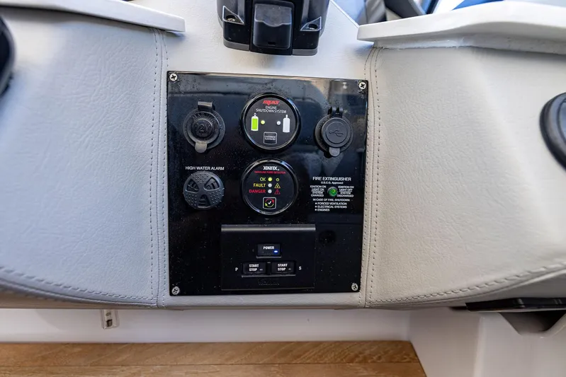 Absolutely Knot Yacht Photos Pics Control panel of 2022 Regal LX36 boat with safety and power features.