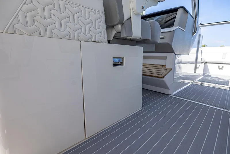 Absolutely Knot Yacht Photos Pics 2022 Regal LX36 boat interior with sleek seating and modern dashboard design.