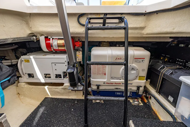 Absolutely Knot Yacht Photos Pics Engine room of 2022 Regal LX36 with Fischer Panda generator and fire extinguisher.