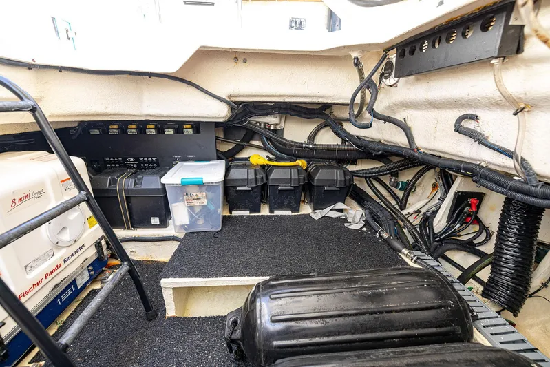 Absolutely Knot Yacht Photos Pics Engine room of 2022 Regal LX36 boat with generator and wiring.