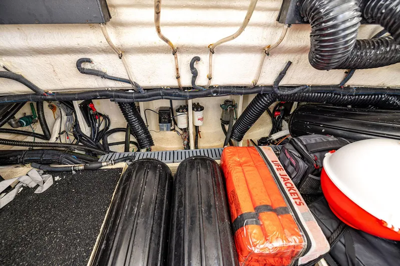 Absolutely Knot Yacht Photos Pics 2022 Regal LX36 boat storage area with life jackets and equipment.