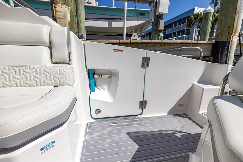 Absolutely Knot Yacht Photos Pics 2022 Regal LX36 boat interior with white seating and modern design elements.