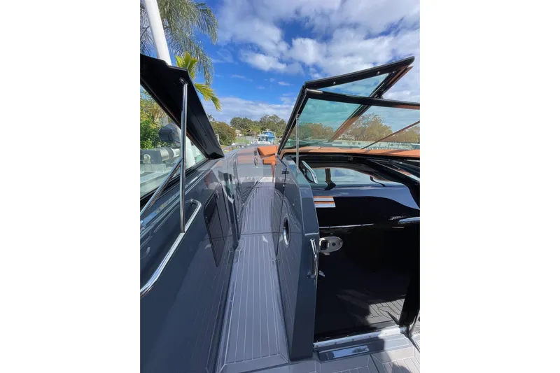  Yacht Photos Pics 2023 Cruisers Yachts 38 GLS I/O deck with open glass doors under blue sky.