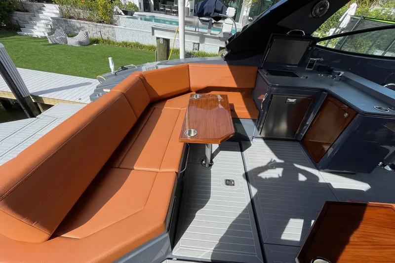  Yacht Photos Pics 2023 Cruisers Yachts 38 GLS I/O interior with orange seating and kitchenette.