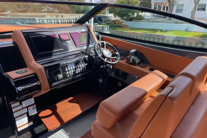  Yacht Photos Pics 2023 Cruisers Yachts 38 GLS I/O helm with modern controls and luxurious seating.