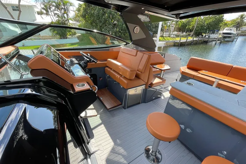  Yacht Photos Pics 2023 Cruisers Yachts 38 GLS I/O interior with luxurious seating and modern helm.