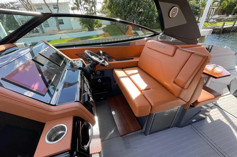  Yacht Photos Pics 2023 Cruisers Yachts 38 GLS I/O helm with luxurious seating and modern dashboard.