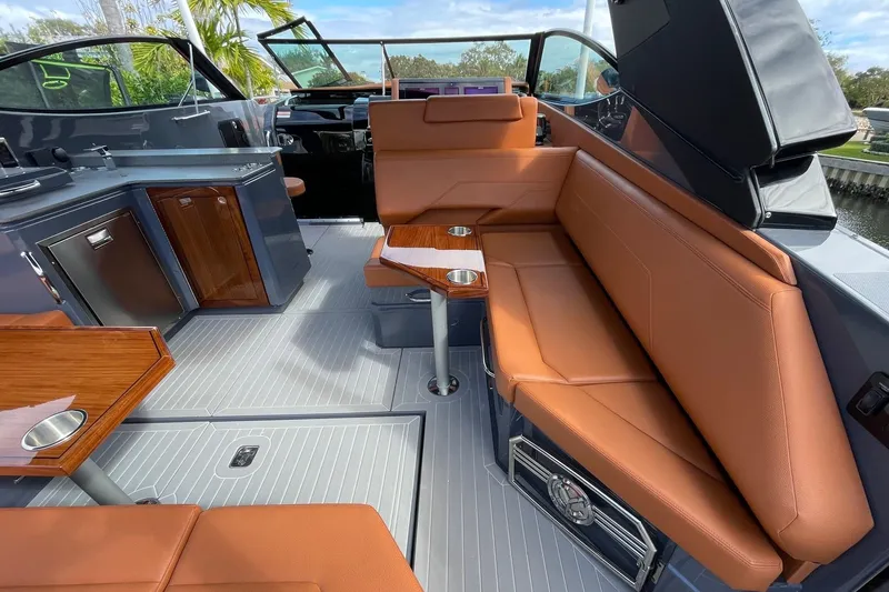  Yacht Photos Pics 2023 Cruisers Yachts 38 GLS I/O interior with tan seating and sleek cabinetry.