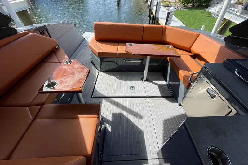  Yacht Photos Pics 2023 Cruisers Yachts 38 GLS I/O interior with luxurious seating and tables.