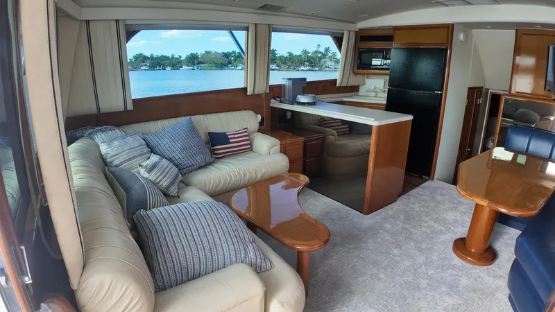  Yacht Photos Pics Luxurious interior of a 1999 Viking 47 Convertible yacht with plush seating and scenic views.