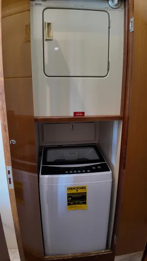  Yacht Photos Pics Stacked washer and dryer in 1999 Viking 47 Convertible yacht.