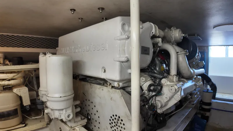  Yacht Photos Pics Engine room of a 1999 Viking 47 Convertible yacht, showcasing machinery and components.