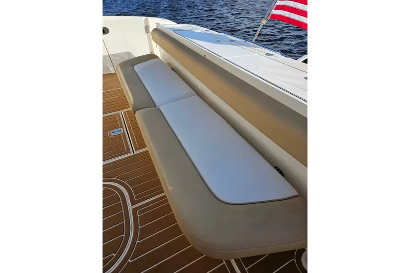 Low Hours! Yacht Photos Pics Luxury seating on 2006 Sea Ray 580 Sedan Bridge yacht, with American flag and teak deck.