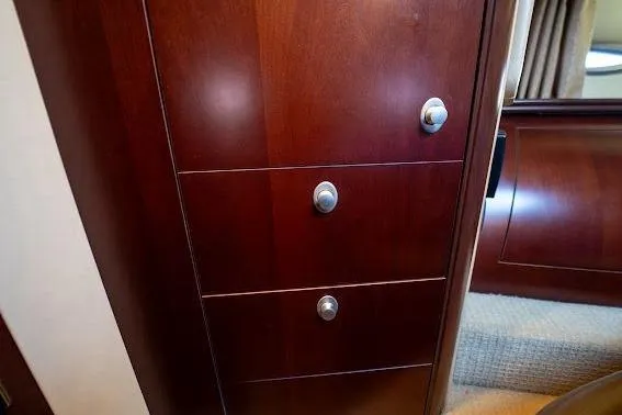 Low Hours! Yacht Photos Pics Wooden cabinet with drawers inside a 2006 Sea Ray 580 Sedan Bridge yacht.
