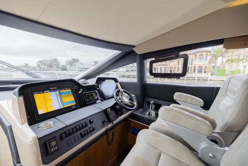 Andiamo Yacht Photos Pics Luxurious helm of 2017 Sea Ray 59 Flybridge yacht with advanced navigation systems.