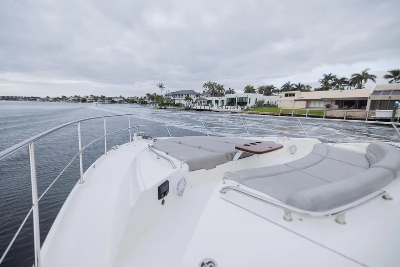 Andiamo Yacht Photos Pics 2017 Sea Ray 59 Flybridge yacht with spacious deck and waterfront view.