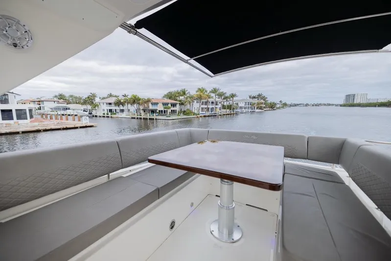 Andiamo Yacht Photos Pics 2017 Sea Ray 59 Flybridge yacht with spacious seating and waterfront view.