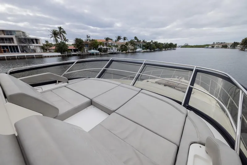 Andiamo Yacht Photos Pics 2017 Sea Ray 59 Flybridge yacht with spacious deck overlooking waterfront homes.