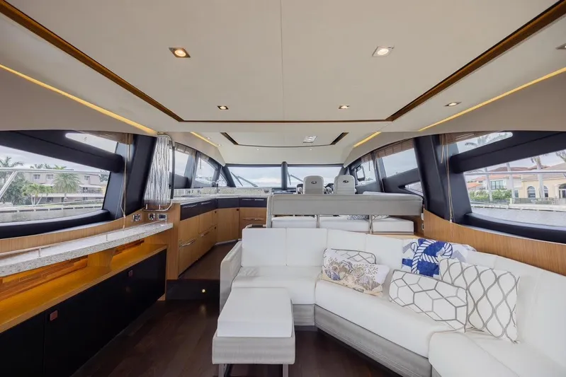 Andiamo Yacht Photos Pics Luxurious interior of 2017 Sea Ray 59 Flybridge yacht with modern seating and panoramic windows.