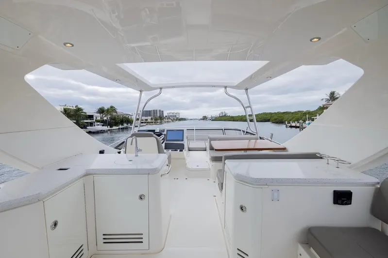 Andiamo Yacht Photos Pics Luxurious 2017 Sea Ray 59 Flybridge yacht interior with modern amenities and scenic waterway view.