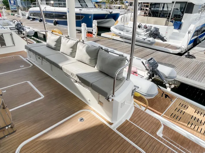  Yacht Photos Pics Luxury seating area on 2020 Fountaine Pajot MY 44 yacht, docked at marina.