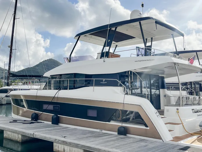  Yacht Photos Pics 2020 Fountaine Pajot MY 44 yacht docked at marina under cloudy sky.