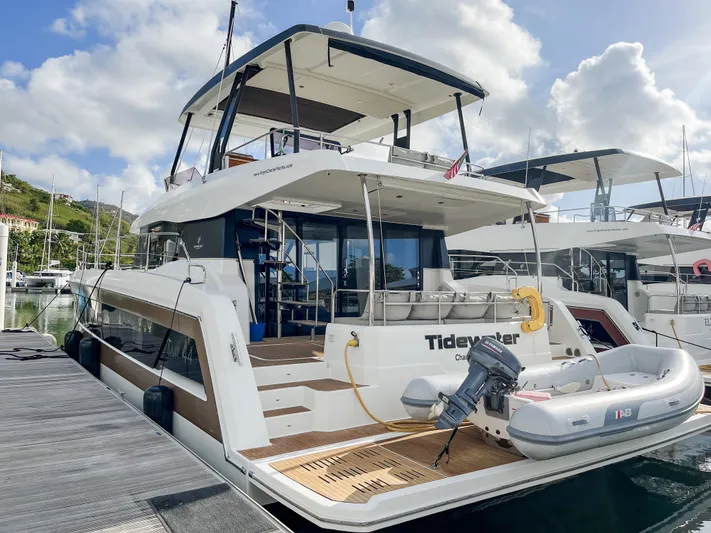  Yacht Photos Pics Luxury 2020 Fountaine Pajot MY 44 yacht docked at marina, featuring spacious deck and modern design.
