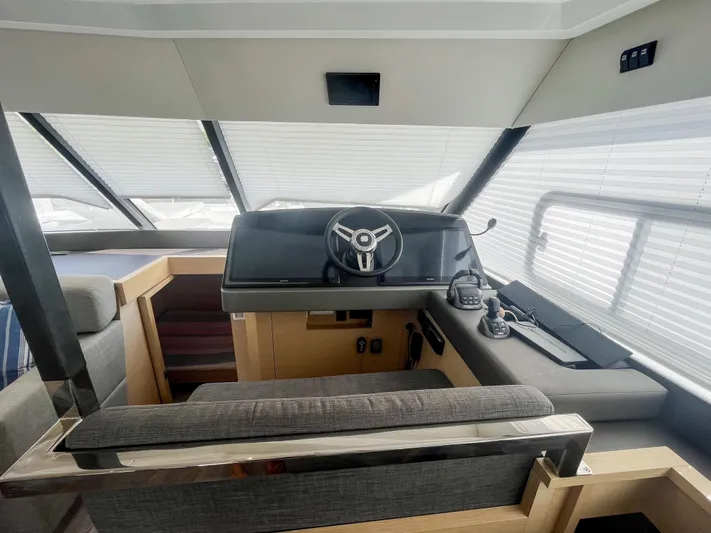  Yacht Photos Pics 2020 Fountaine Pajot MY 44 helm station with modern steering and navigation equipment.