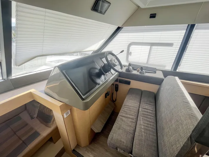  Yacht Photos Pics 2020 Fountaine Pajot MY 44 yacht interior with modern helm and seating area.