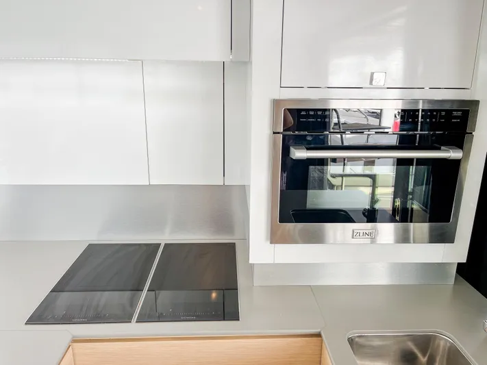  Yacht Photos Pics Modern kitchen in 2020 Fountaine Pajot MY 44 yacht with sleek appliances and minimalist design.