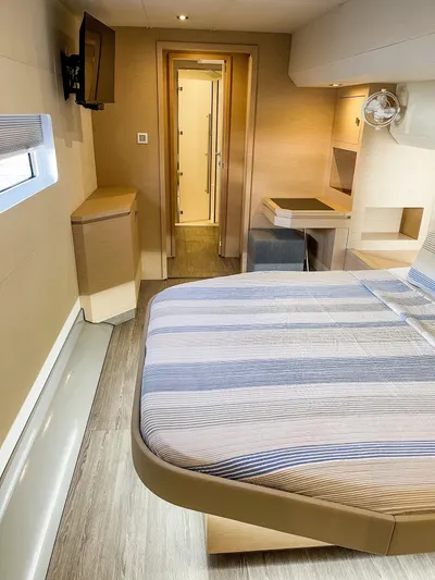  Yacht Photos Pics 2020 Fountaine Pajot MY 44 cabin interior with bed, window, and modern furnishings.