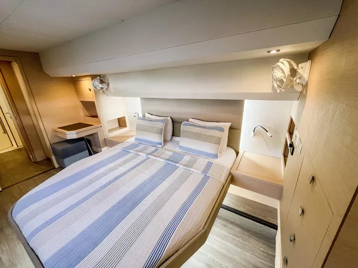  Yacht Photos Pics Luxurious cabin interior of 2020 Fountaine Pajot MY 44 yacht with cozy bed and modern design.