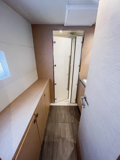  Yacht Photos Pics Interior of 2020 Fountaine Pajot MY 44 yacht, featuring modern cabinetry and sleek design.