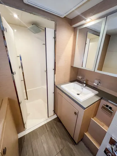  Yacht Photos Pics Modern bathroom on 2020 Fountaine Pajot MY 44 yacht with shower and vanity.
