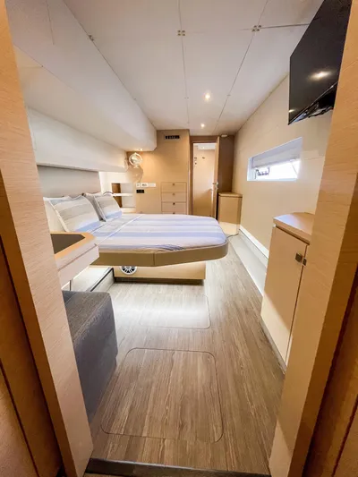  Yacht Photos Pics Luxurious cabin interior of 2020 Fountaine Pajot MY 44 yacht, featuring modern design and cozy bedding.