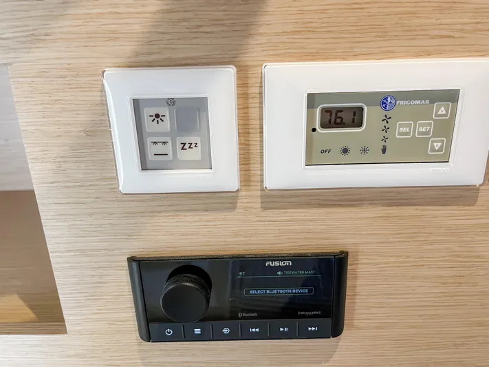  Yacht Photos Pics Control panel on 2020 Fountaine Pajot MY 44 yacht, featuring thermostat and audio system.