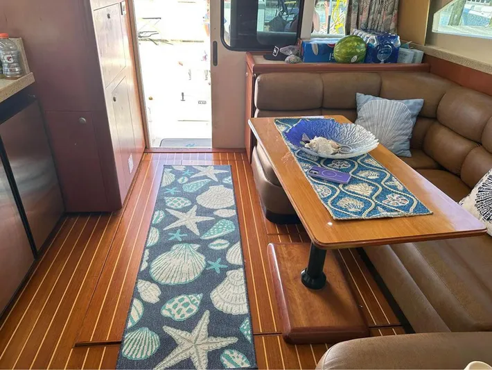  Yacht Photos Pics Interior of 2005 Luhrs 36 Convertible yacht with cozy seating and nautical decor.