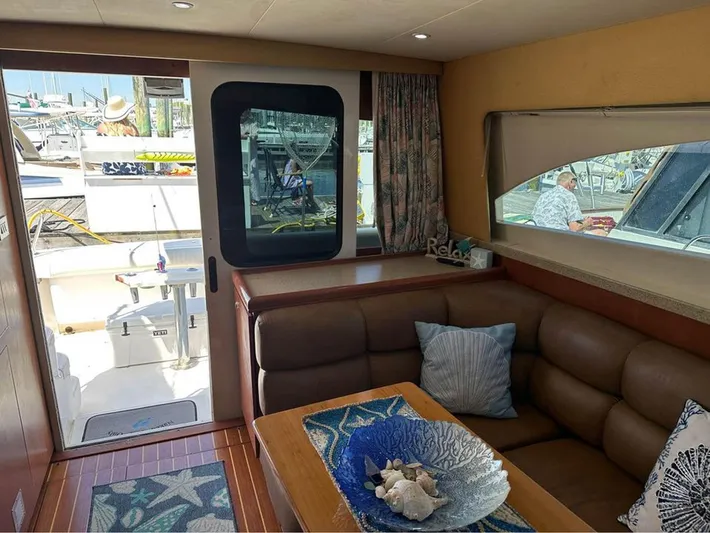  Yacht Photos Pics Interior of 2005 Luhrs 36 Convertible yacht with cozy seating and decorative accents.