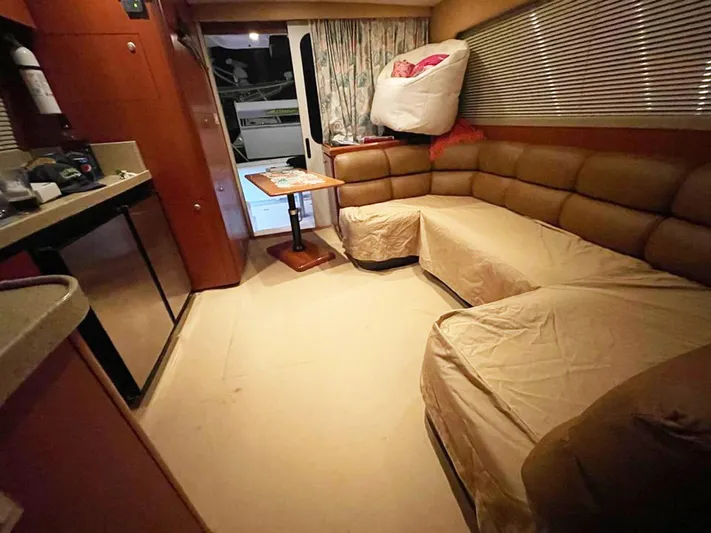  Yacht Photos Pics Interior of 2005 Luhrs 36 Convertible yacht with cozy seating and compact kitchen area.