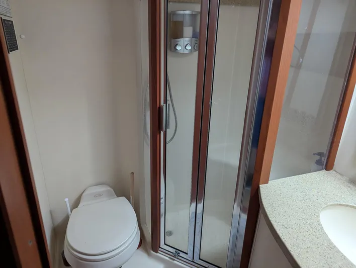  Yacht Photos Pics Bathroom interior of 2005 Luhrs 36 Convertible yacht with shower and toilet.