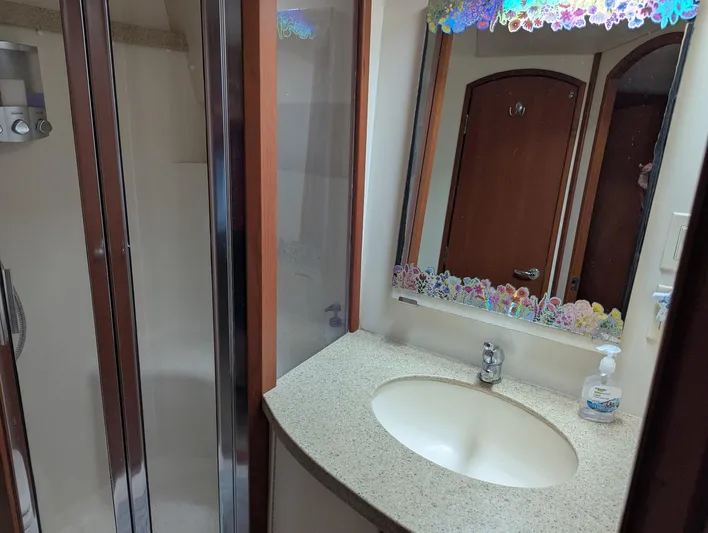  Yacht Photos Pics Bathroom interior of 2005 Luhrs 36 Convertible yacht with shower and sink.